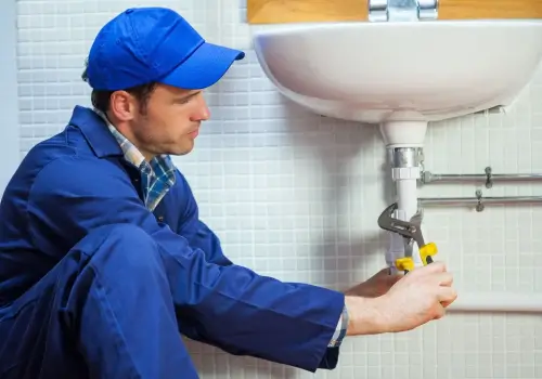 Plumber Fixing the Sink